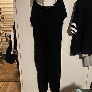 Has Pockets!!! Super flattering jumpsuit. One piece.